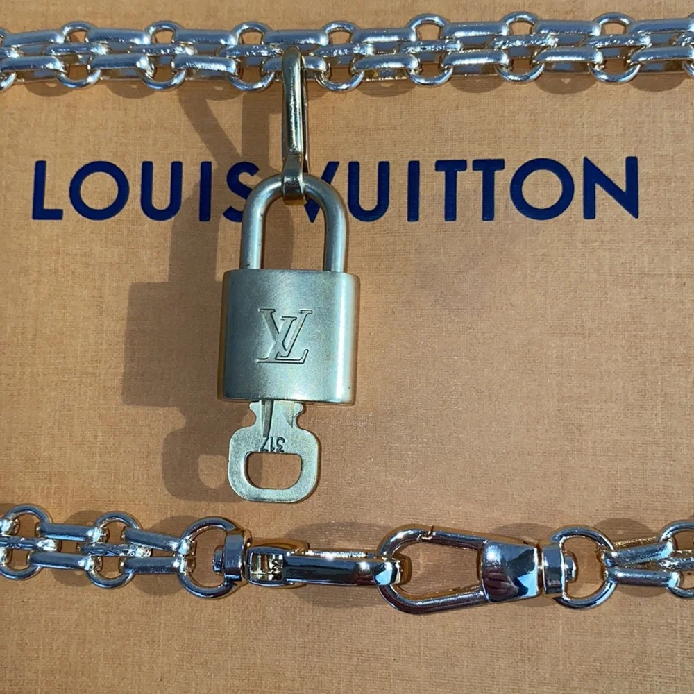 Authentic Louis Vuitton Lock and Key Set on a Chain. - Picture 7 of 10